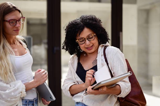 istock student communicating with her professor outdoors. 1715554595