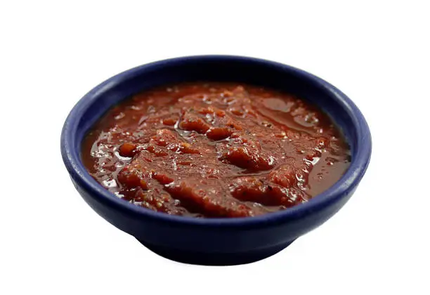A small bowl of five chile salsa. Isolated on a white background with clipping path. Please note:  clipping paths are only included if you download the largest available (the original) size of the file. 