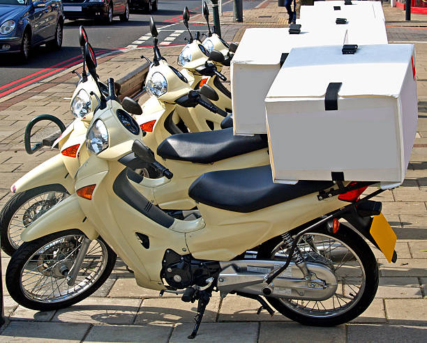 Motorcycles with pizza boxes in back for delivery