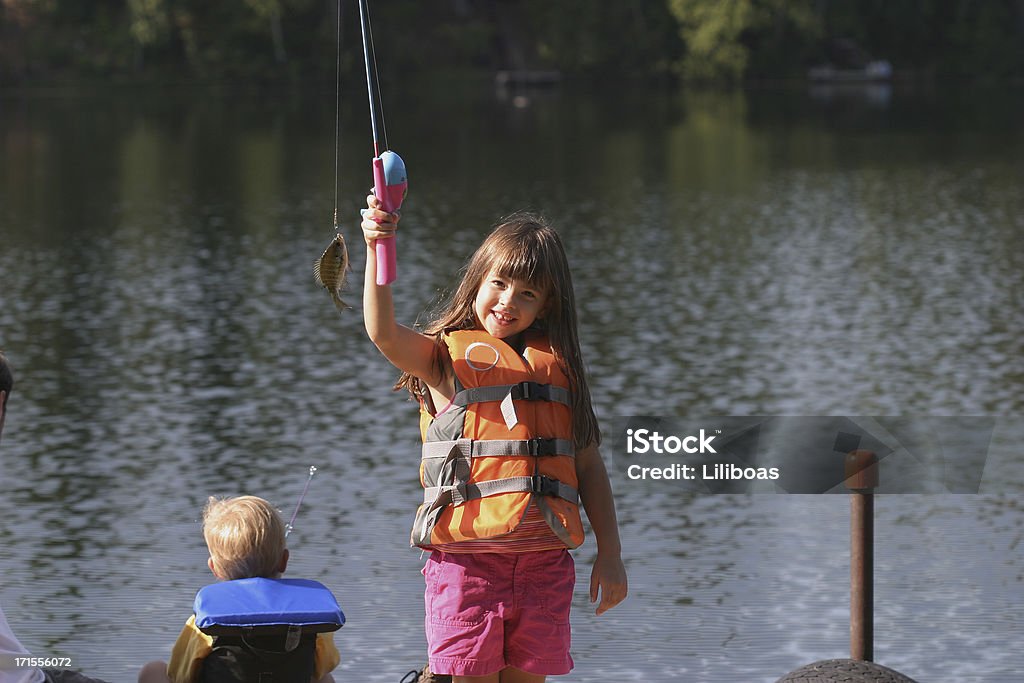 Serie Lovin'pesca - Foto stock royalty-free di Bambino