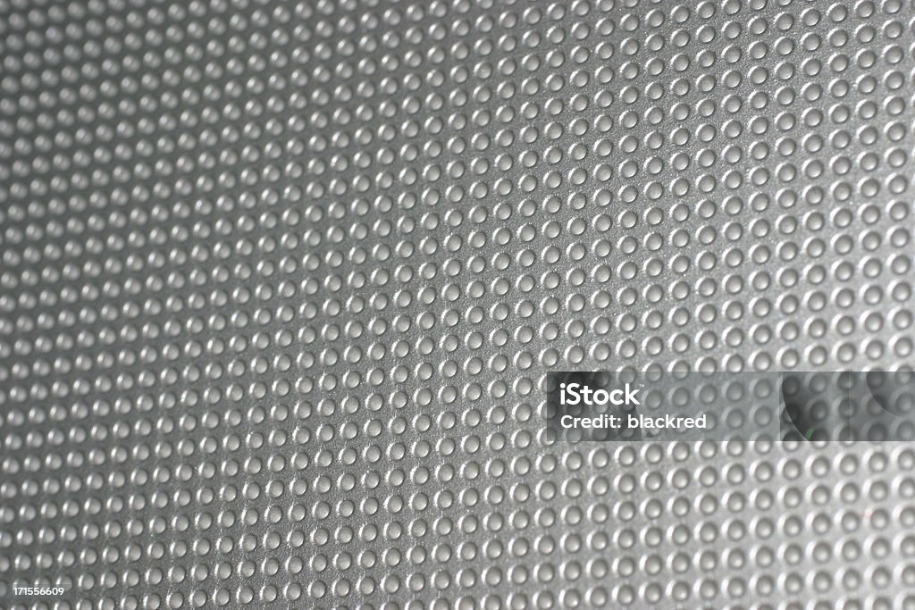 Chrome Surface Silver chrome surface with holes. Abstract Stock Photo