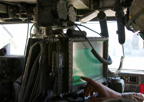 Touch Screen LCD Panel mounted in HMMWV as part of the Blue Force Tracker / FBCB2 system. Soldier is preparing system to go out on a combat patrol.