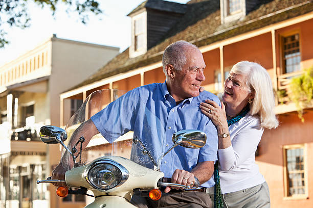 istock Senior couple with motor scooter 171557351