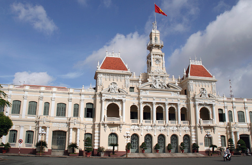 people's committee building in ho chi minh city on a monsoon morning