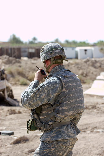 Soldier using hald-held radio in Ramadi, Iraq. 