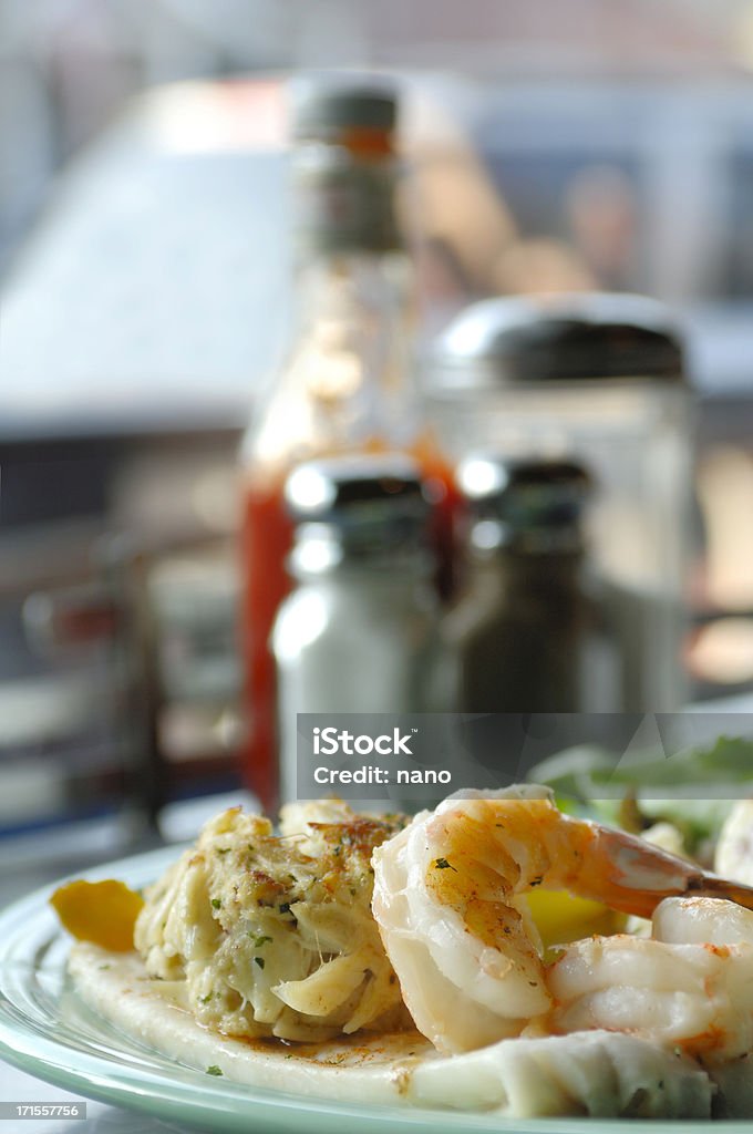 Seafood  Combination "Seafood combination platter to include crab cake, flounder and shrimp." Condiment Stock Photo