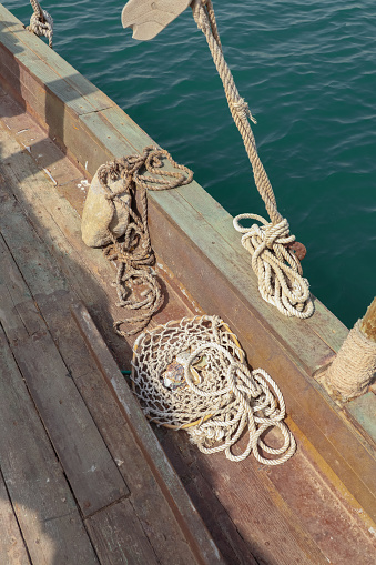 Old wood sailing boat used for pearl diving with ropes and wood planks