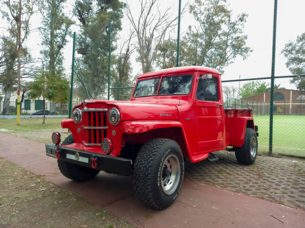 old jeep ika estanciera baqueano ex overland willys pickup truck 1960s in a park. classic car show - pick up truck red old 4x4 imagens e fotografias de stock