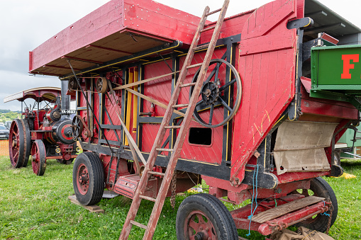 Low Ham.Somerset.United Kingdom.July 23rd 2023.An old fashioned threshing machine is on show at the Somerset steam and country show