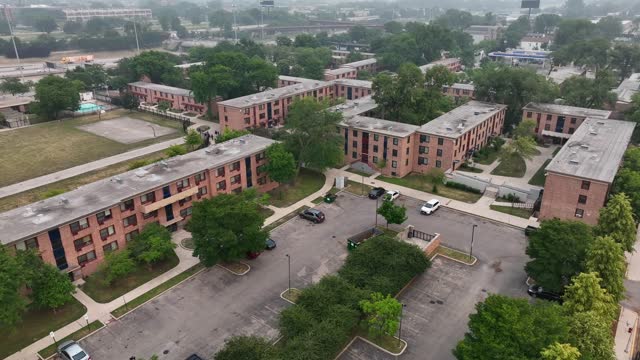 Apartments in city suburb. Ugly and dangerous housing area in USA. Aerial establishing shot.