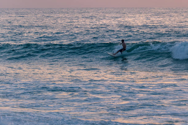 istock Surfer riding waves in Furadouro Beach 1715660209