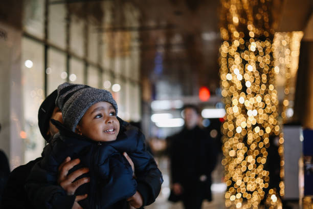 istock little boy Christmas shopping with dad 1715662422