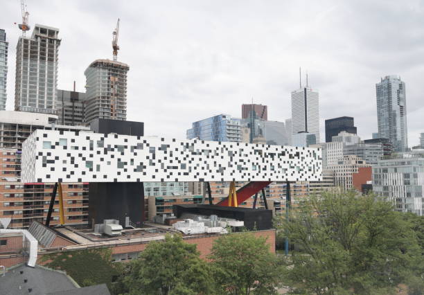 Kensington-Chinatown Neighbourhood, Toronto, Canada Toronto, Canada - August 25, 2023: The OCAD University stands on McCaul Street. Modern residential towers under construction in the background. Summer afternoon with cloudy skies. ocad stock pictures, royalty-free photos & images