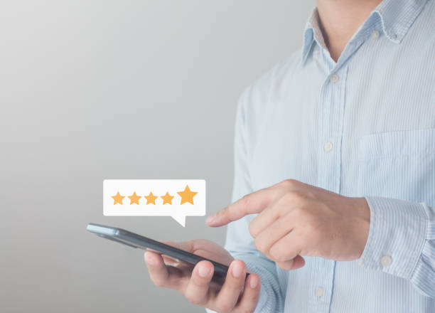 istock Customer review satisfaction feedback survey concept. Client or employee using smartphone are happy to give 5 star rate for service experience opinion on online survey. Business Quality is Service. 1715671480