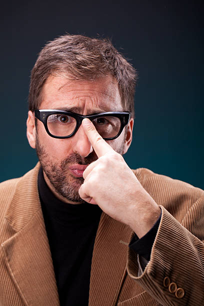 Italian Designer with Retro Eyeglasses Making a Geeky Expression stock photo
