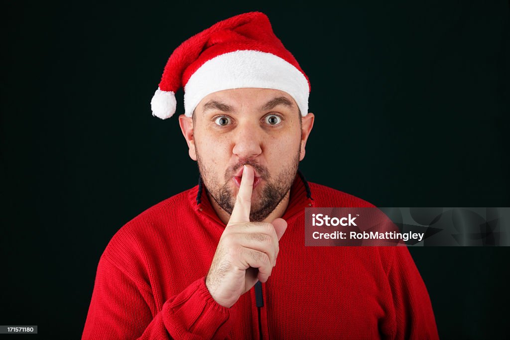 Secret Santa - Lizenzfrei Finger auf den Mund legen Stock-Foto