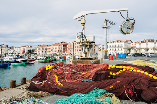 Saint Jean de Luz, France - December 29, 2022: Fishing boats moored without going out to fish during holidays.