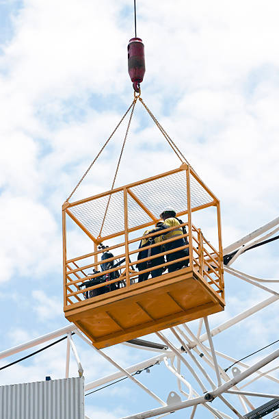 istock Emergency crew inspecting damages on tower crane, copy space 171571222