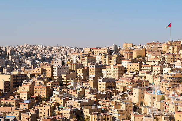 Skyline of Amman, Jordan Buildings and skyline of Amman, Jordan. The Jordanian flag is on the upper right. A mosque on the lower right (blue dome). amman city stock pictures, royalty-free photos & images