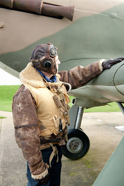 istock WW2 RAF Pilot With Fighter Aircraft 171571495