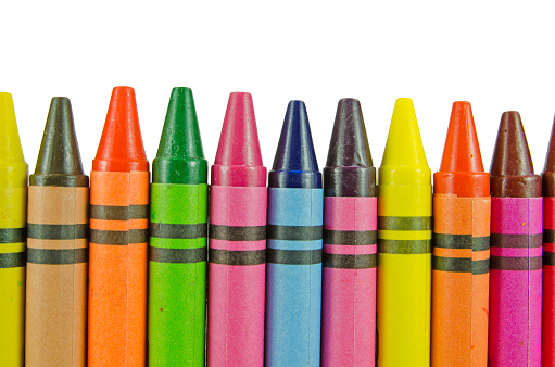 New crayons lined-up on a white background with clipping path. These are not Crayola crayons.