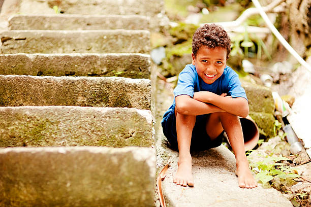 A young boy from a favela in Rio de Janeiro, Brazil is a happy boy, despite poverty.