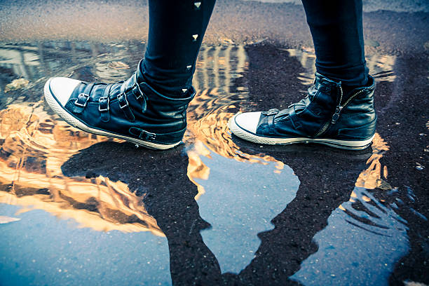 istock Woman walking outdoor after a rainfall 171571524
