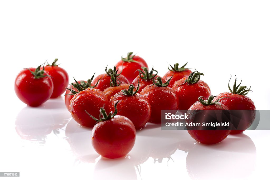 wet cherry tomatoes wet cherry tomatoes on white backgroundsee my Back Lit Stock Photo