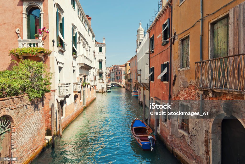 Venetian Water Alley Venice is under the protection of UNESCO as a world heritage site. The historic city centre gets about 12 to 20 million tourists per year. Focus of picture is on the right side. 12 O'Clock Stock Photo