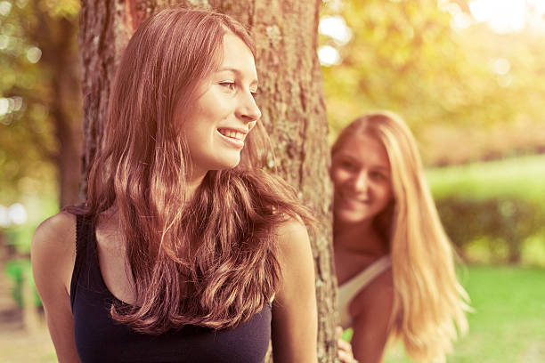 istock Friends playing hide and seek in the park 171571682