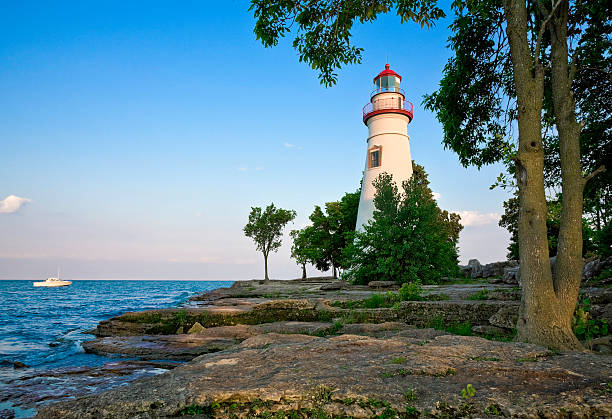 Marblehead Lighthouse - Lake Erie, Ohio Ohio's Marblehead Lighthouse State Park on Lake Erie.  Marblehead Lighthouse is the oldest, continuously operational lighthouse on the Great Lakes. It has been featured on a U.S. postage stamp and has appeared on the license plates of Ohio's drivers.  It was recently added to the Ohio State Parks system ohio photos stock pictures, royalty-free photos & images