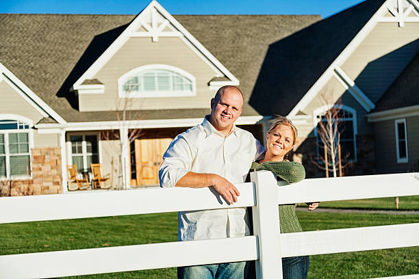 istock Young Married Couple at Home Leaning on Fence 171571867