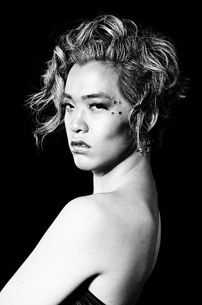 Portrait of an extraordinary young woman. She is a cinema beauty.