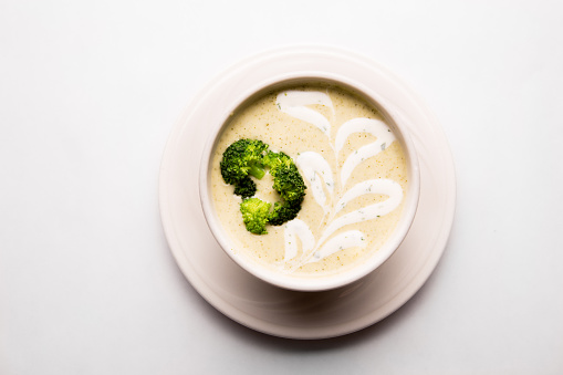 Cream of Broccoli Soup on a white table cloth