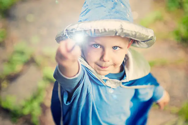 Little wizard casting a spell.