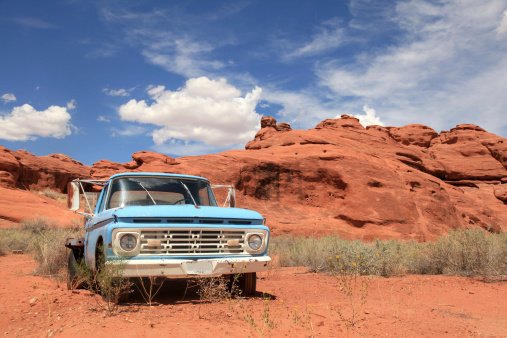 Abandoned blue truck in the desert