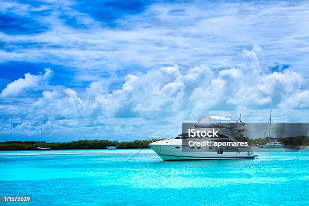 Luxury Yacht Anchored In A Tropical Island Turquoise Beach Stock Photo - Download Image Now