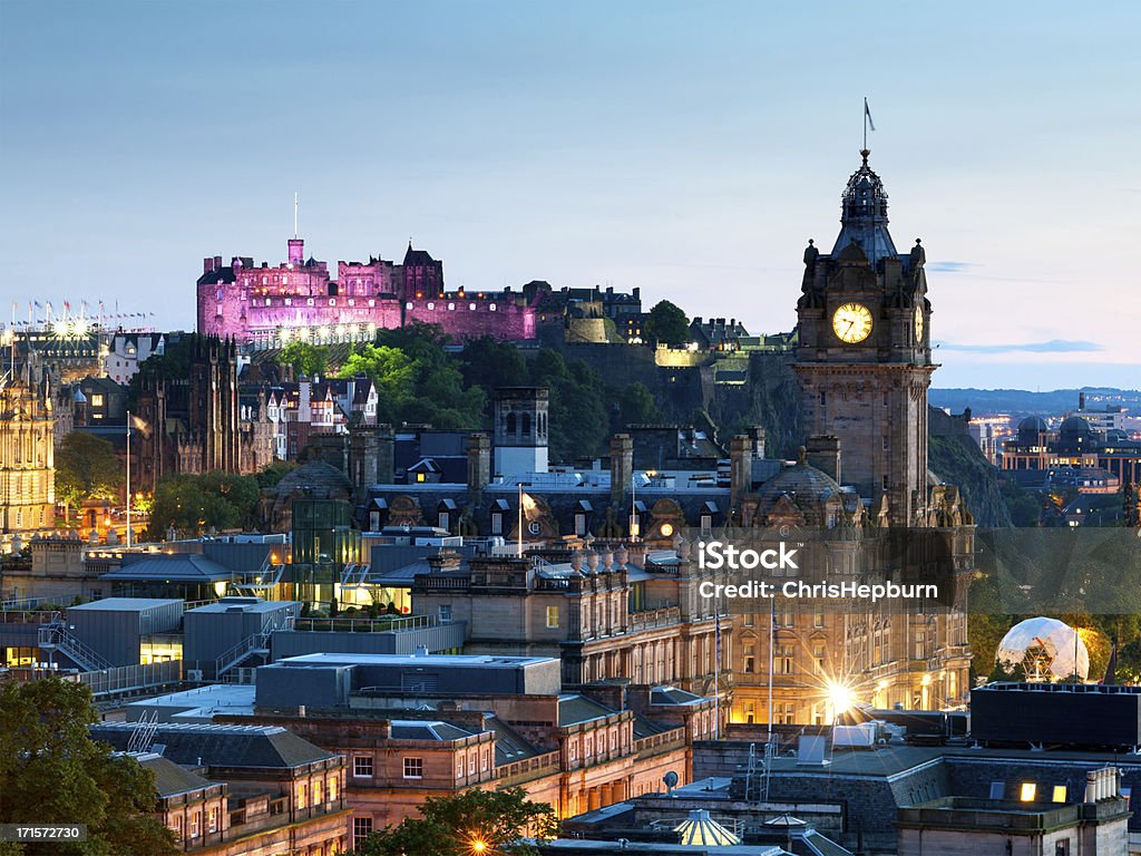 Edinburgh Cityscape, Scotland Looking across the city of Edinburgh from Calton Hill at dusk. The Balmoral Hotel and an illuminated Edinburgh Castle can be seen. Edinburgh - Scotland Stock Photo