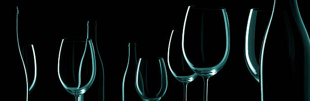 Wine Bottles And Glasses Wine Bottles And Glasses on black background.Monochrome silhouettes. wine bottle photos stock pictures, royalty-free photos & images