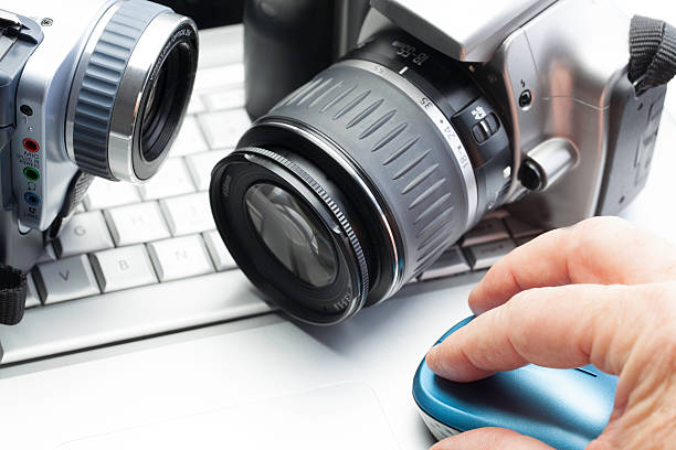 Private Investigation Cameras and binoculars on keyboard. Concept for private investigation. military private stock pictures, royalty-free photos & images