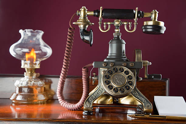 istock Old-fashioned Telephone And Oil Lamp 171573308