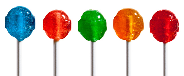 Five isolated closeup shots of detailed translucent lollipops in blue, orange, green, yellow and red colors isolated on a white background. Each shot separately using a Canon 5D MarkII DSLR.