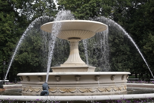 Beige fountain in the city park