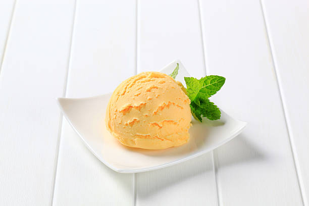 istock Scoop of vanilla ice cream with garnish on a square plate 171573911