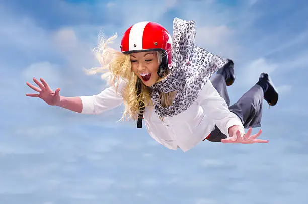 Photo of freefalling businesswoman