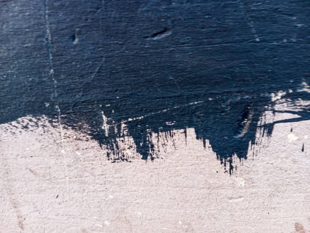 istock Abstract black paint grungy wall textured background. Black paint texture on cement wall. 1715741545