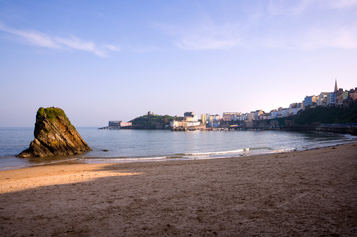 UK, Wales, Pembrokeshire, view of Tenby from North Beach. The town and harbour bathed in autumn sunshine