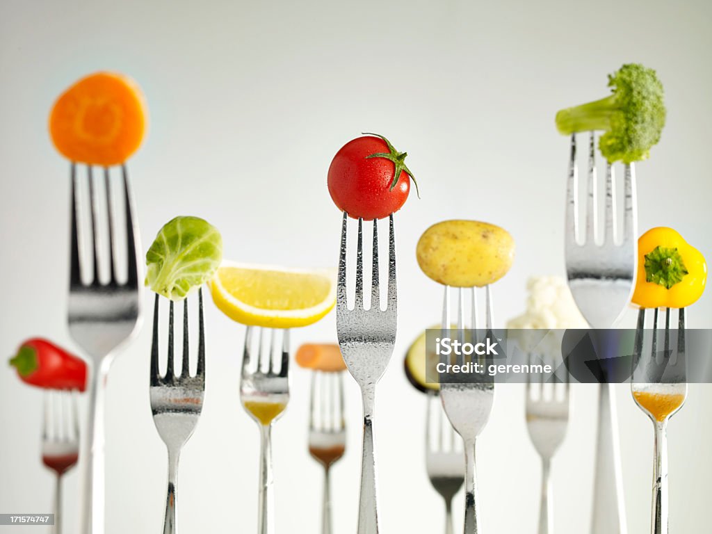 Raw vegetables On Forks Raw foods on forks Healthy Eating Stock Photo