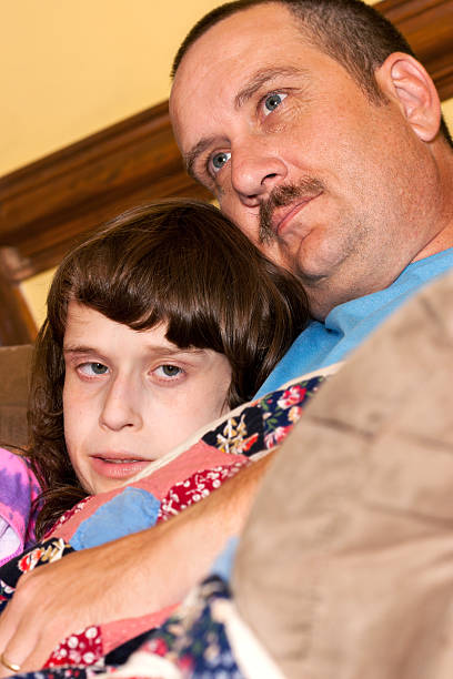 istock Autistic girl cuddles with her Dad 171574772