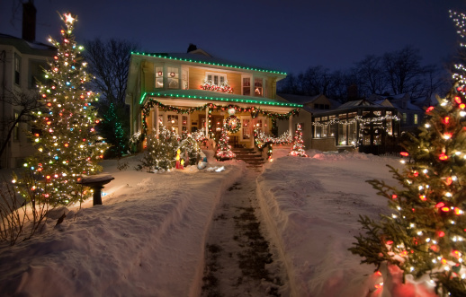Old Historic Home with christmas lights and snow